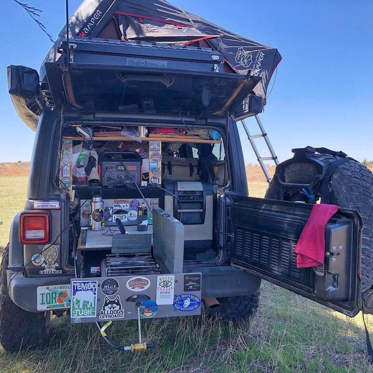overland 4x4 with gear in the backend