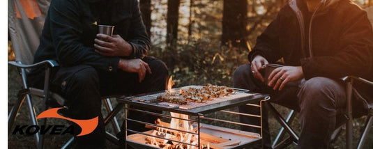 two campers enjoying grilled meat with a Kovea portable camp grill