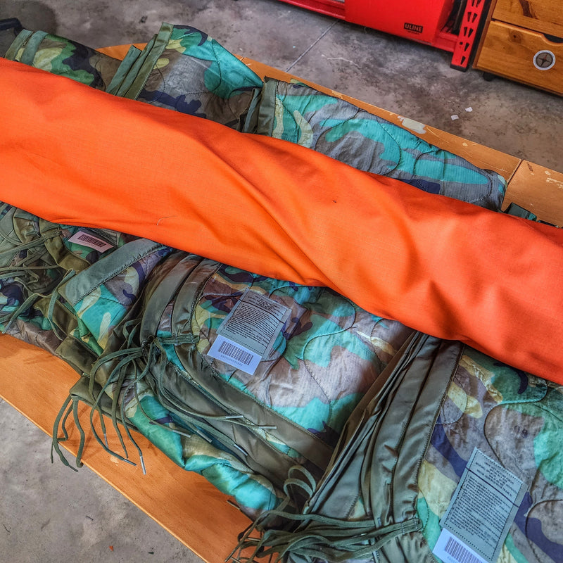 Load image into Gallery viewer, Woobie Hank: Insulated with USGI poncho-liner, serves as a large rag, knee pad, and adventure companion tool.
