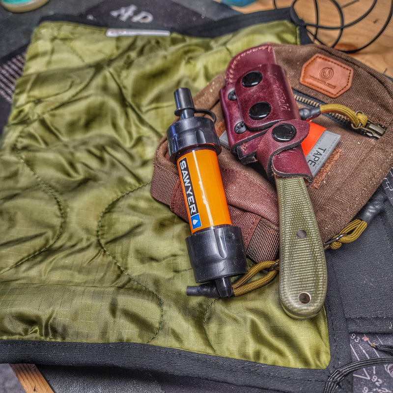 Load image into Gallery viewer, Woobie Hank: Insulated with USGI poncho-liner, serves as a large rag, knee pad, and adventure companion tool.
