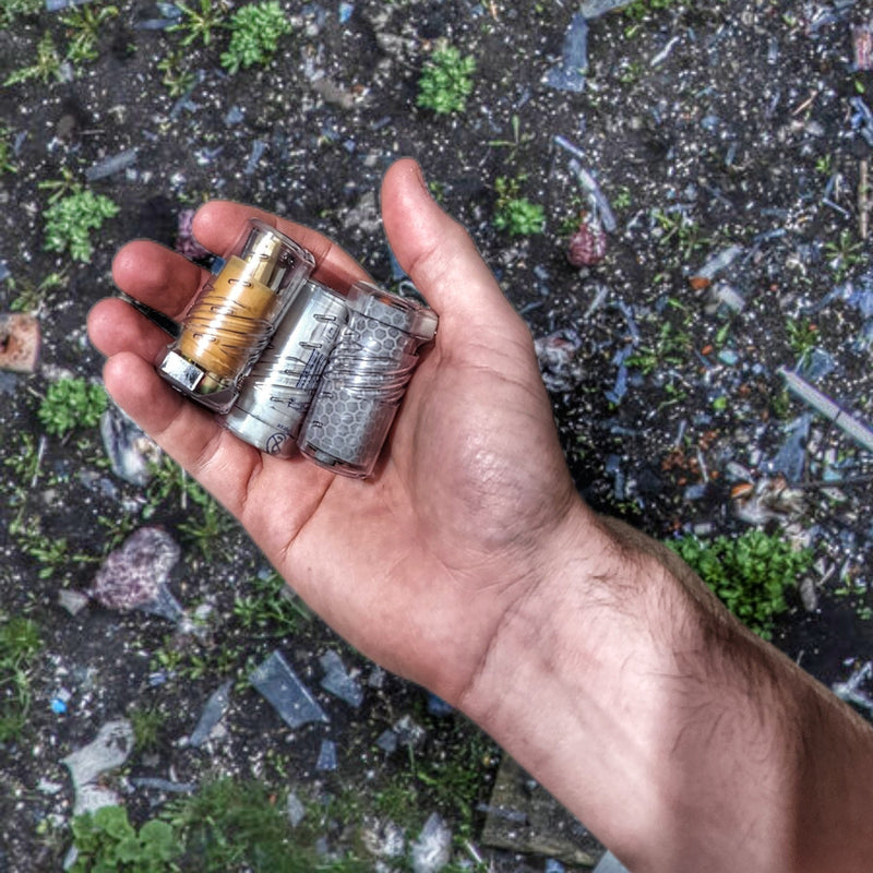 Load image into Gallery viewer, Drop Shell - Polymer Capsule filled with Survival, Escape, and First-Aid Supplies.
