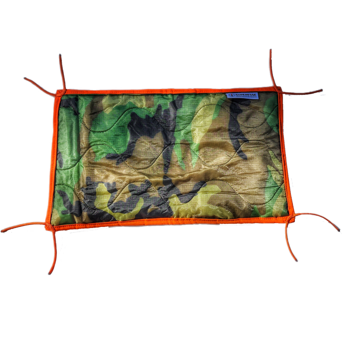 Woobie Hank: Insulated with USGI poncho-liner, serves as a large rag, knee pad, and adventure companion tool.