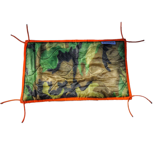 Woobie Hank: Insulated with USGI poncho-liner, serves as a large rag, knee pad, and adventure companion tool.