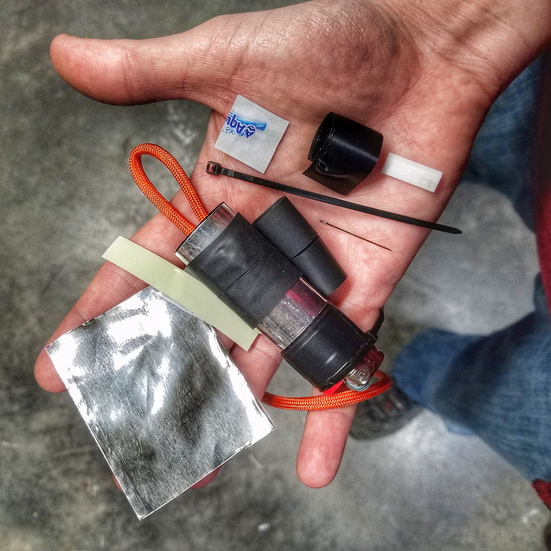Load image into Gallery viewer, Survival Kit Lighter - Fire Starter outfitted with supplies.
