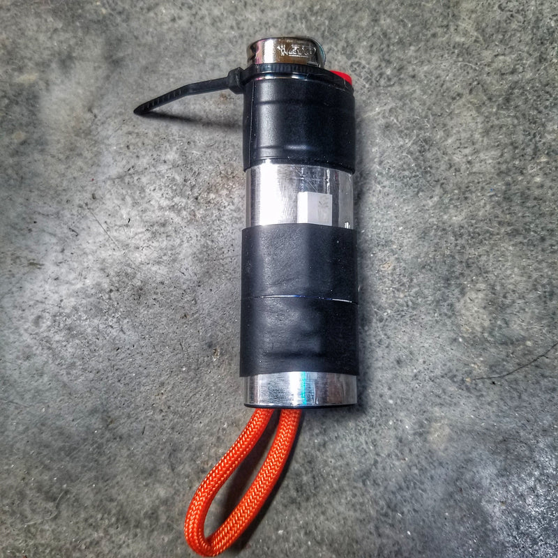 Load image into Gallery viewer, Survival Kit Lighter - Fire Starter outfitted with supplies.
