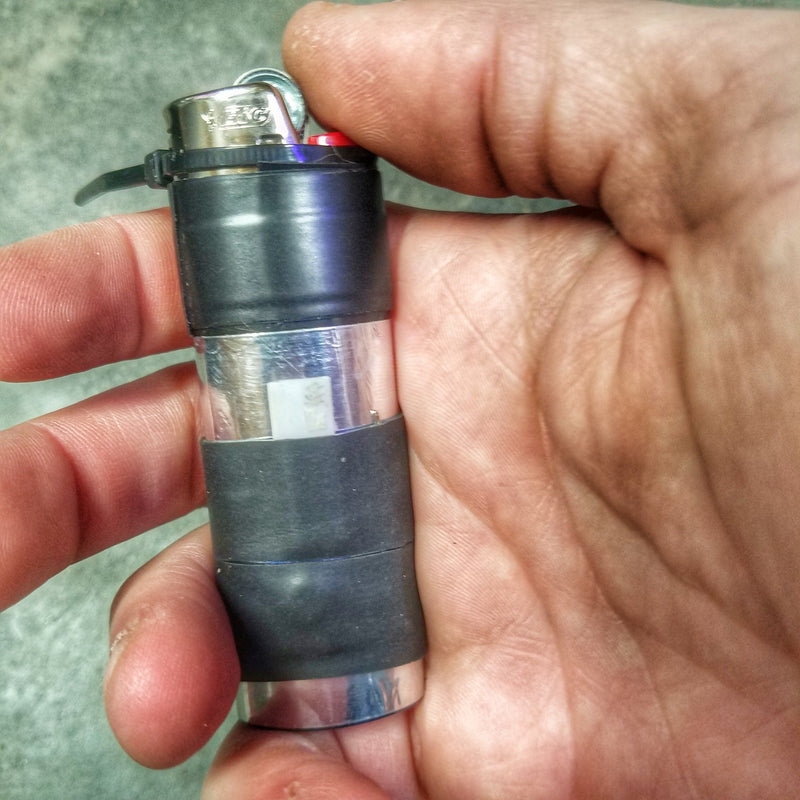 Load image into Gallery viewer, Survival Kit Lighter - Fire Starter outfitted with supplies.
