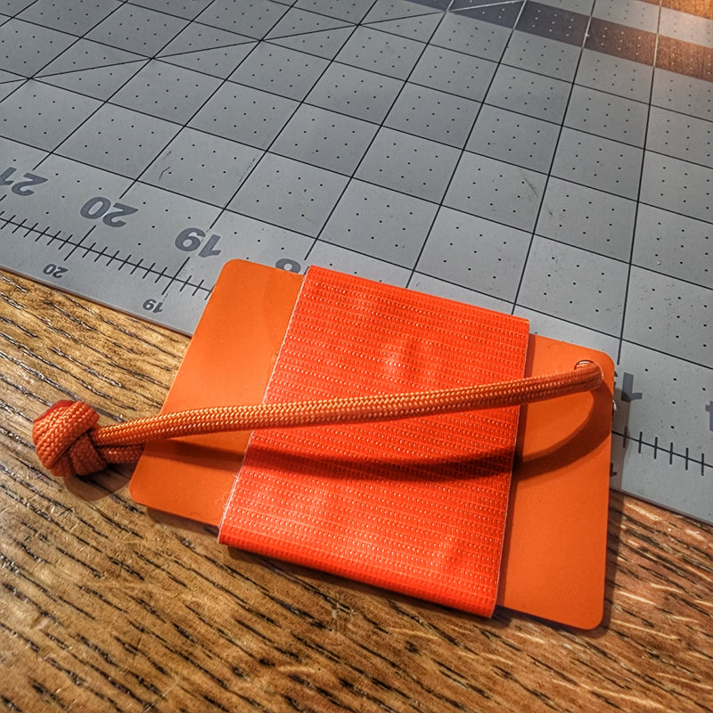 Load image into Gallery viewer, Tape Card - Duct Tape wrapped Orange Credit Card w/ Paracord Lanyard
