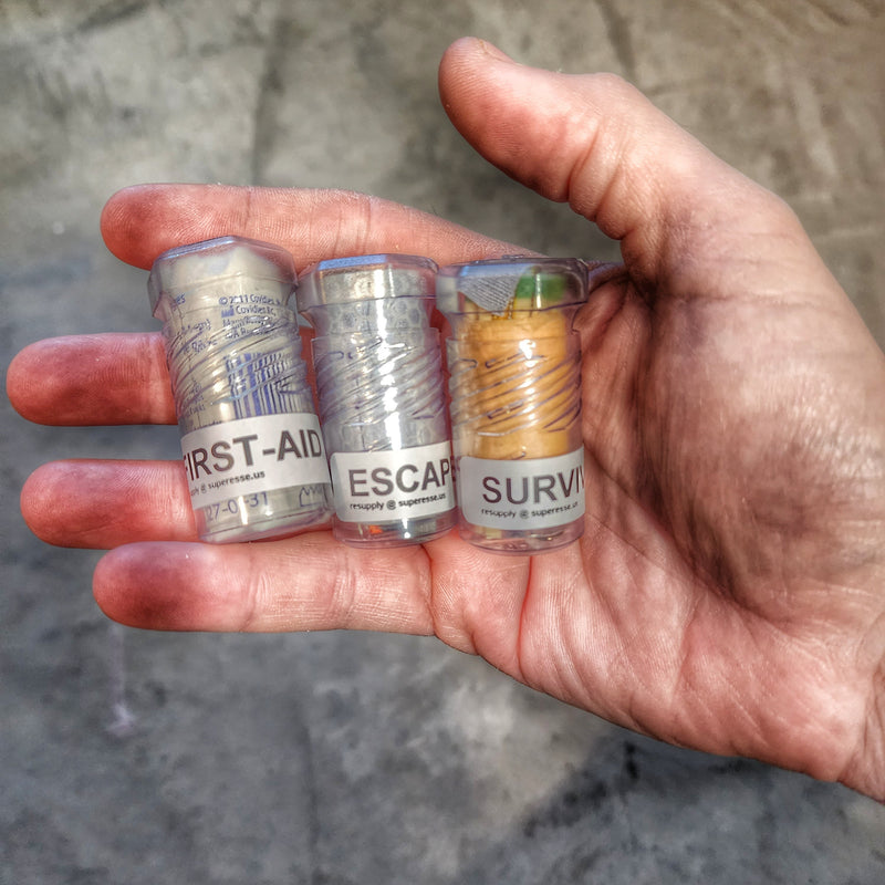 Load image into Gallery viewer, Drop Shell - Polymer Capsule filled with Survival, Escape, and First-Aid Supplies.
